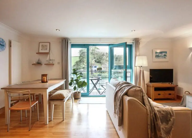 blue windows and doors with a living room inside