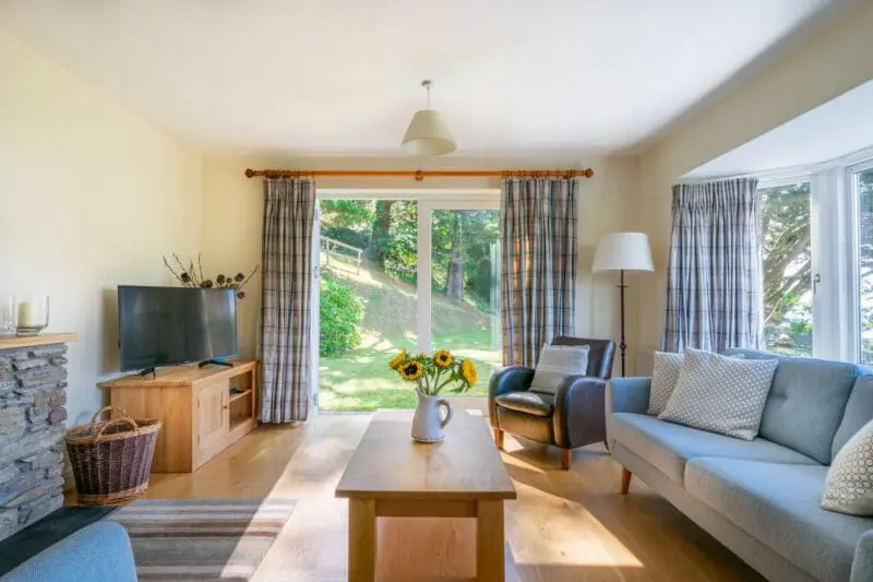 living room with sofa and flowers