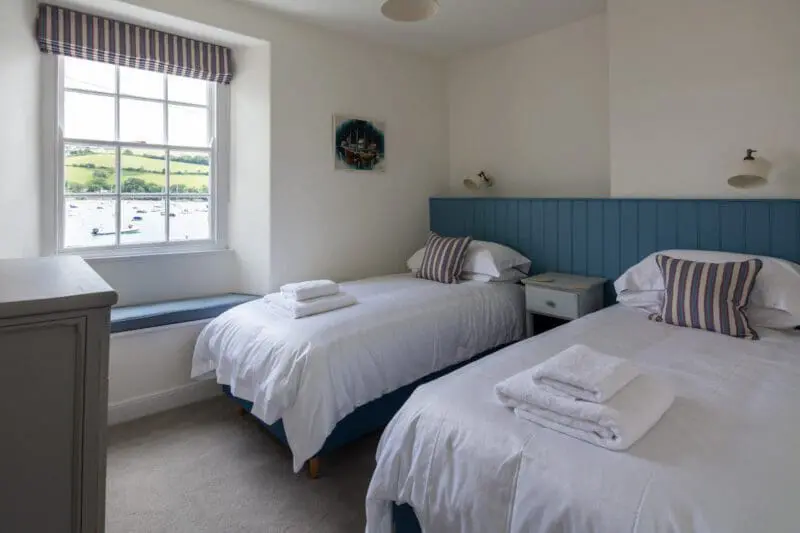 bedroom with two beds and a window