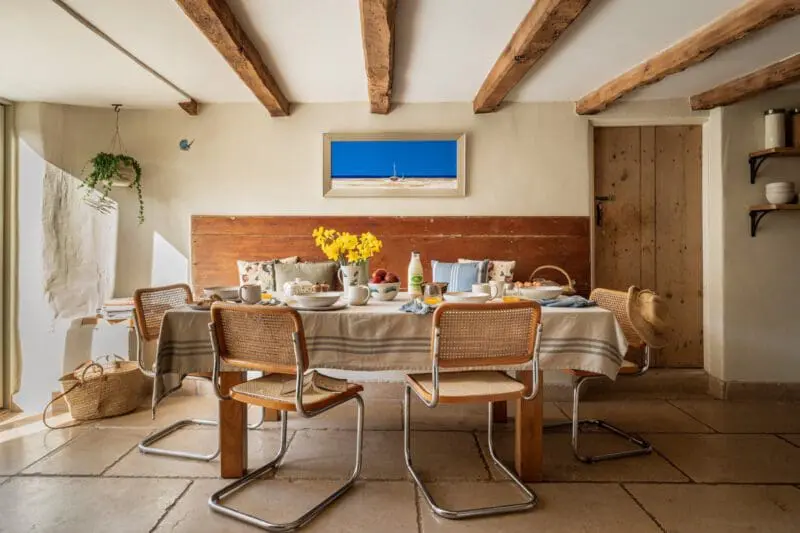 dining table with plates and flowers