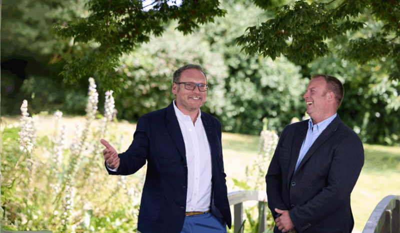 Josh and James laughing in a garden
