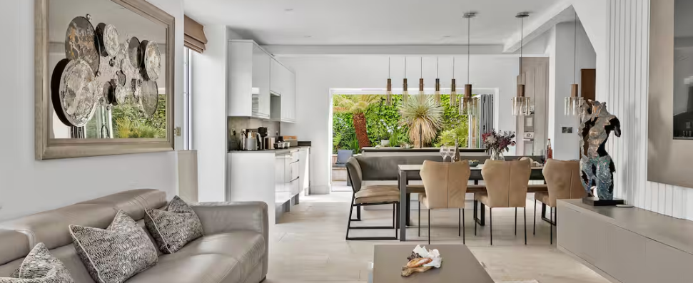 cream and grey dining room with sofas in the foreground