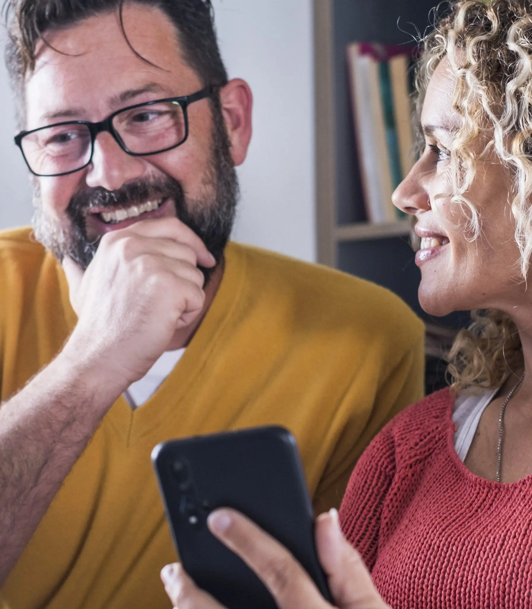 Holiday home owners checking their earnings on the HolidayHost app