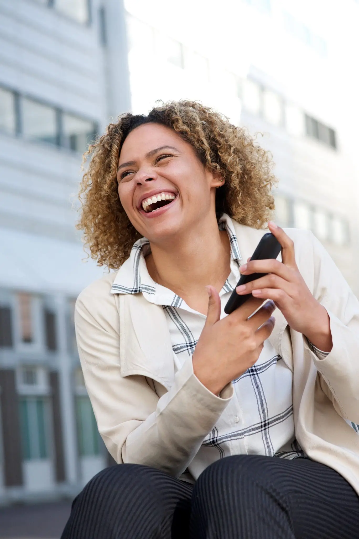 Holiday let owner checking bookings on her phone