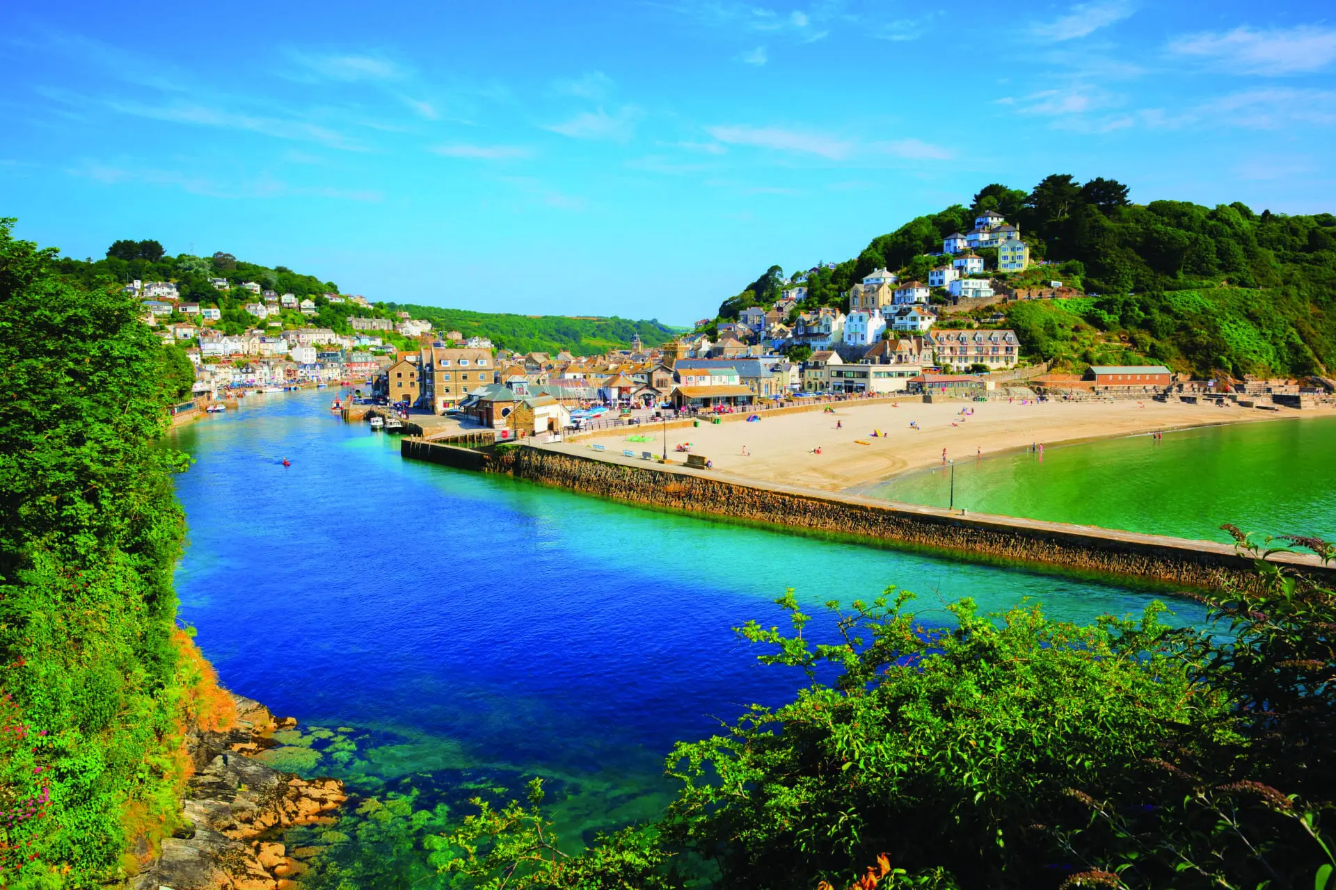 Looe Cornwall town and beach and harbour with beautiful blue sea