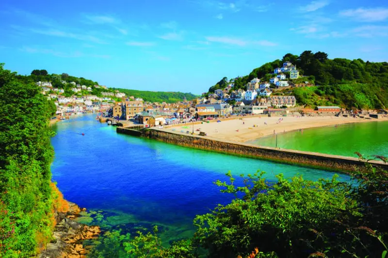 Looe Cornwall town and beach and harbour with beautiful blue sea