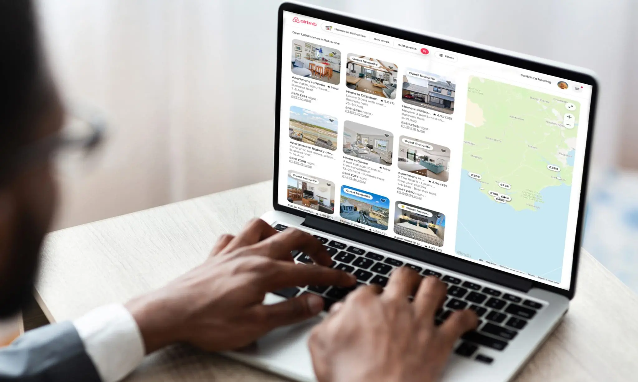Property manager optimising an Airbnb listing on screen