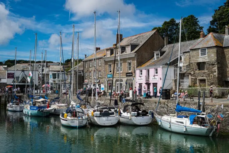 Padstow harbour with boats, shops and community