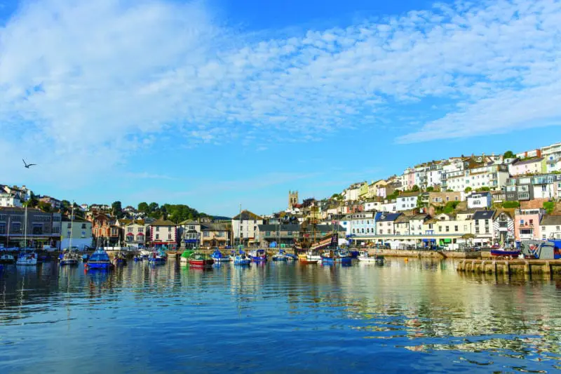 Brixham harbour Devon boats and blue sky