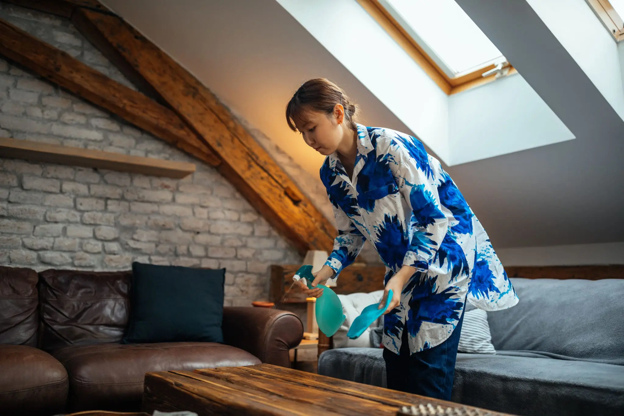Professional cleaner preparing a holiday let for the next guest