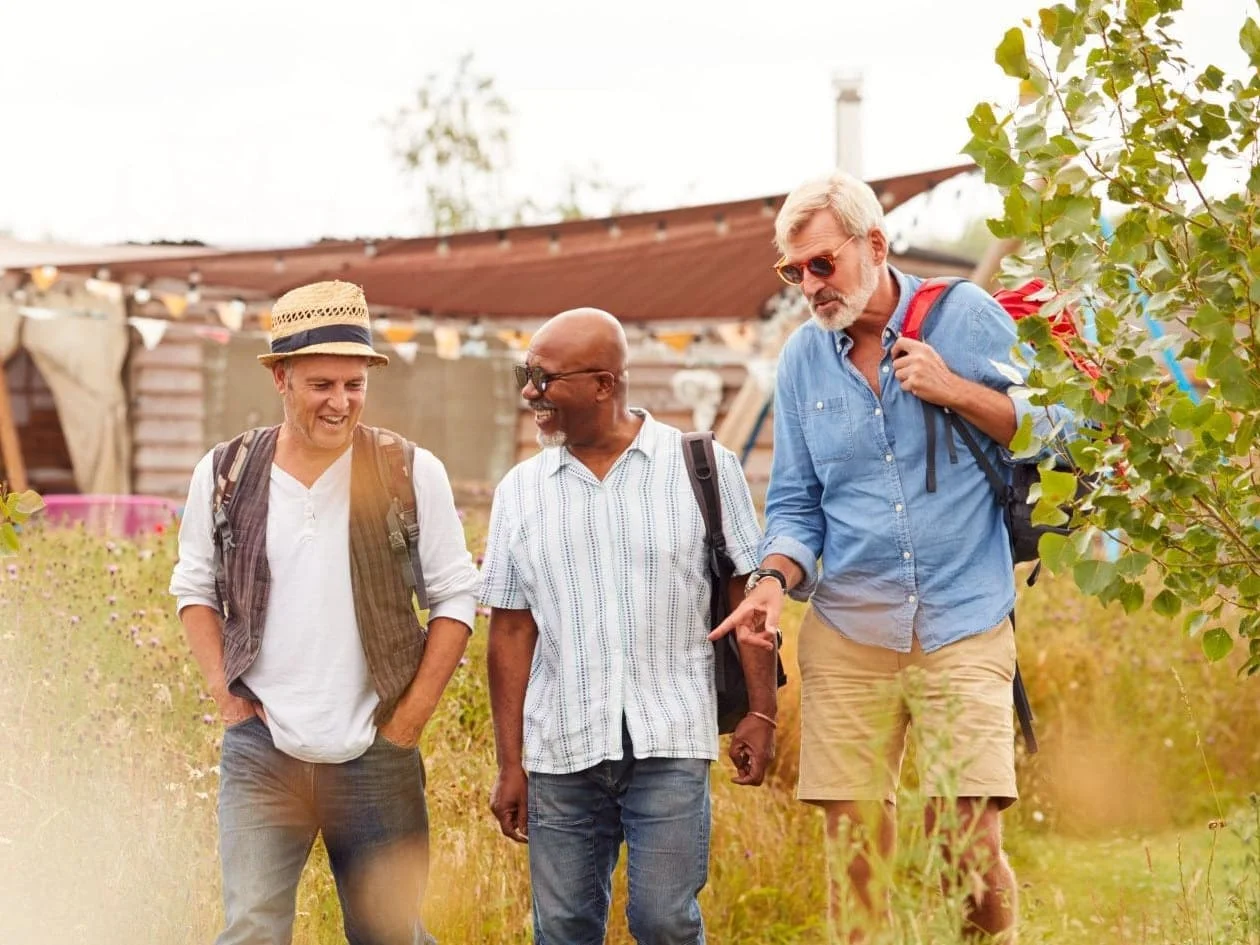Group of men walking in local Cornish town